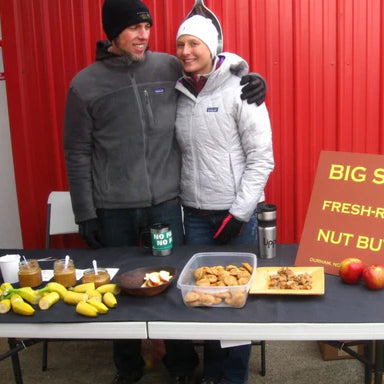 big spoon co-founders at a farmer's market table