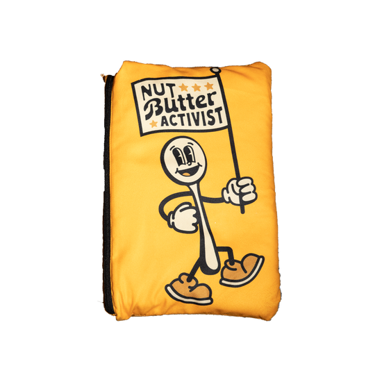 Big Spoon Roasters Blanket Pouch that shows spoon holding a flag which states Nut Butter Activist