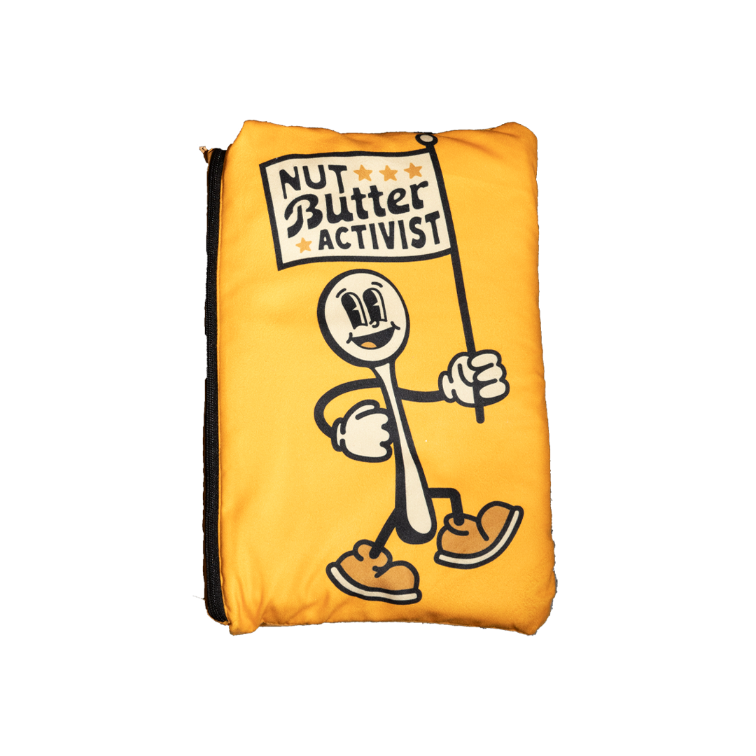 Big Spoon Roasters Blanket Pouch that shows spoon holding a flag which states Nut Butter Activist