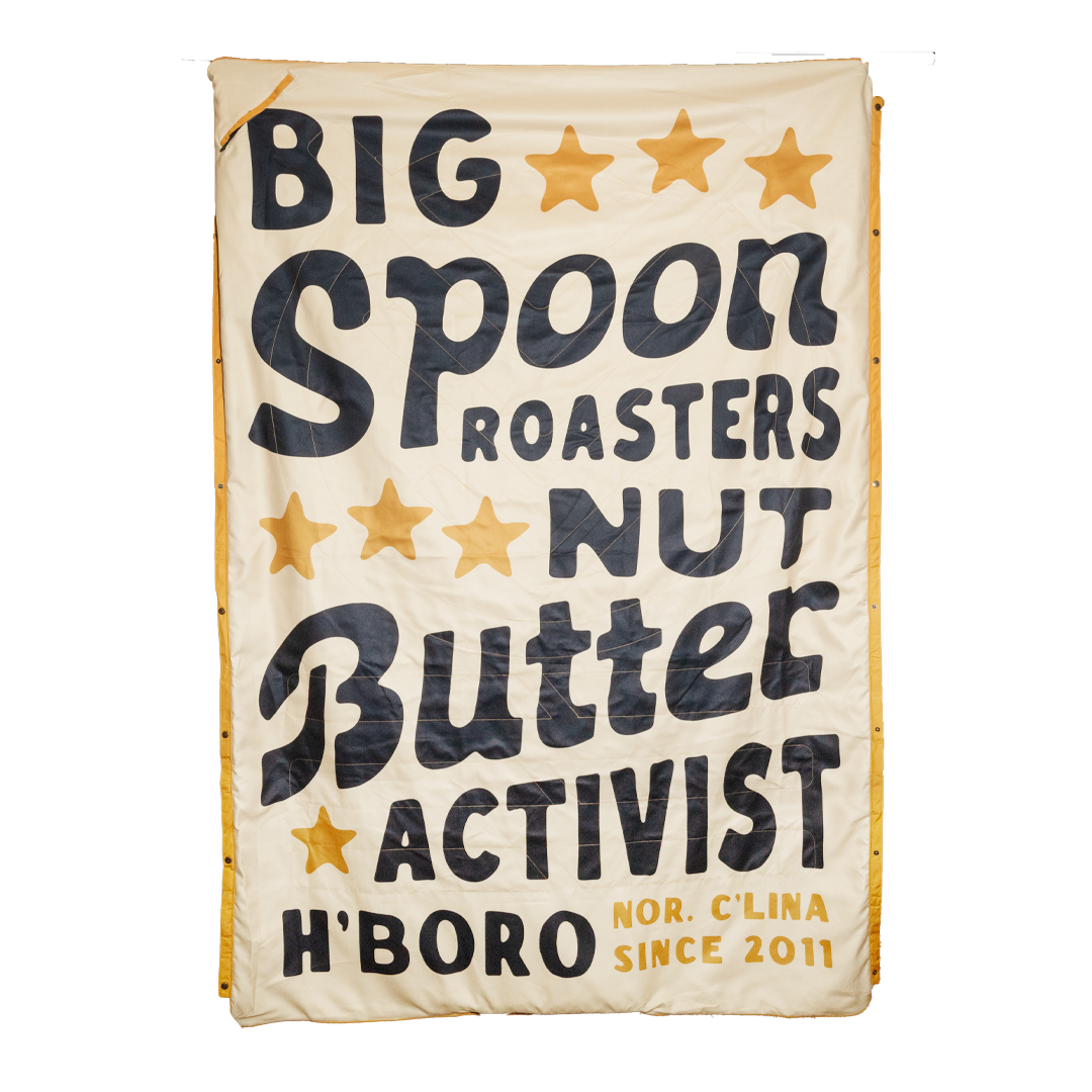 Big Spoon Roasters Beach Blanket that states Big Spoon Roasters Nut Butter Activist H'Boro N'Clina Since 2011