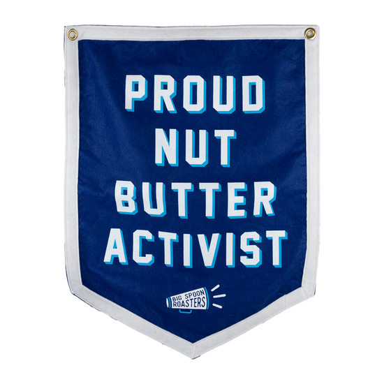 Blue Camp Flag reading PROUD NUT BUTTER ACTIVIST with a megaphone reading BIG SPOON ROASTERS at the bottom center
