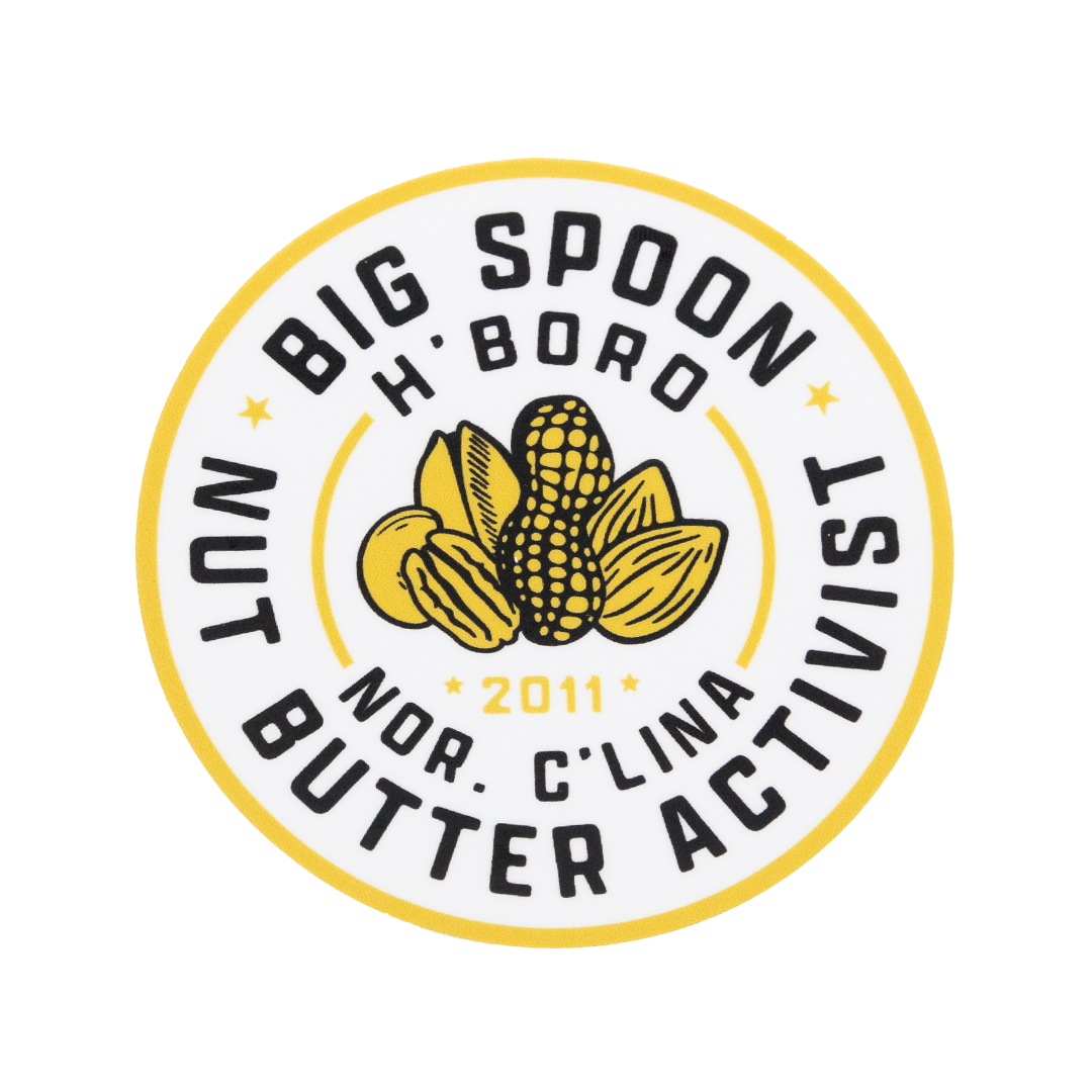 Round sticker reading BIG SPOON NUT BUTTER ACTIVIST | H'BORO NC