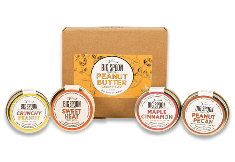 3oz jars of Crunchy Peanut, Sweet Heat, Maple Cinnamon, and Peanut Pecan in front of a gift box