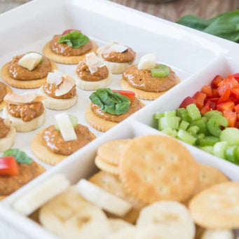 crackers and veggies with nut butter and toppings