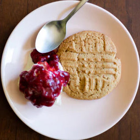 peanut butter cookies with dollop of strawberry jam