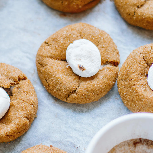 Marshmallow Peanut Butter Cookies on a pan lined with parchment paper