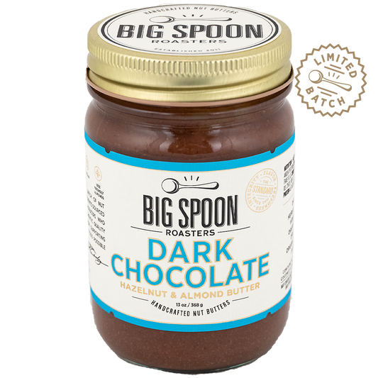 Jar of Big Spoon Roasters Dark Chocolate Hazelnut & Almond Butter with a gold lid on a white background.