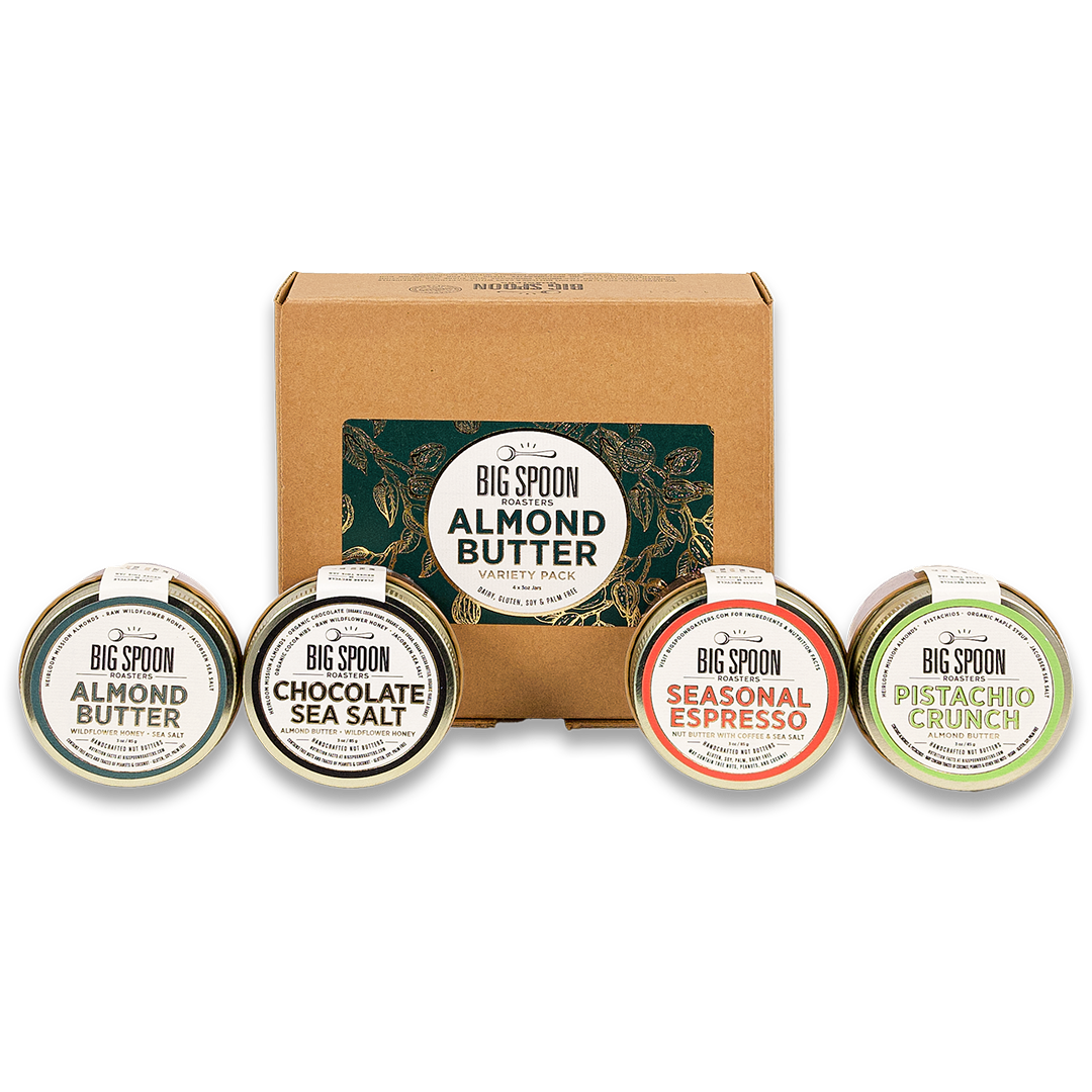 3oz Mini Almond Butter Variety Pack box with mini jars of Almond Butter, Chocolate Sea Salt Almond Butter, Seasonal Espresso Almond Butter, and Pistachio Crunch Almond Butter in front