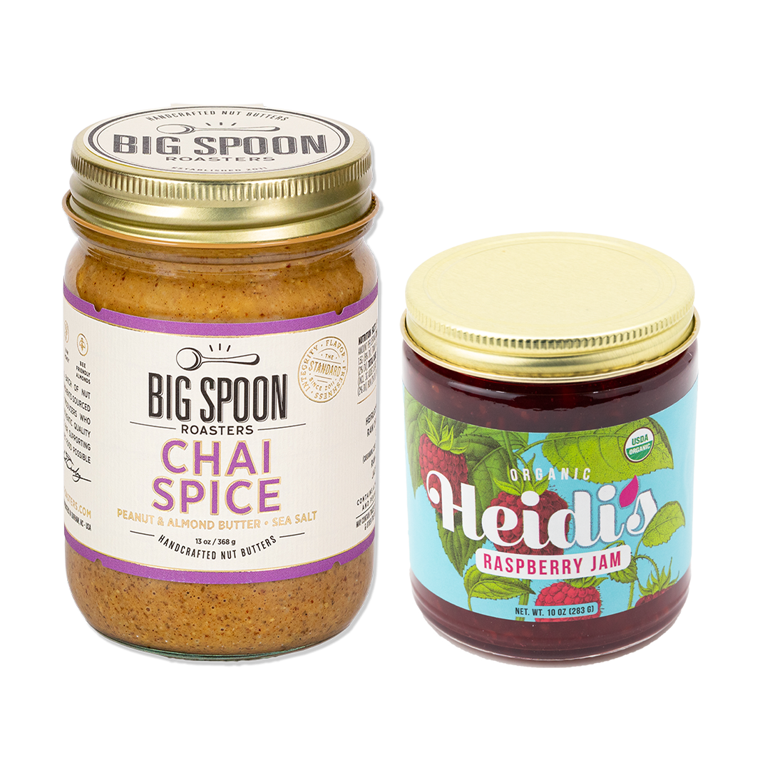 jar of Chai Spice nut butter next to a jar of Heidi's Raspberry jam