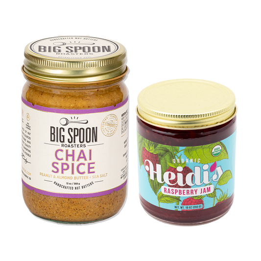 jar of Chai Spice nut butter next to a jar of Heidi's Raspberry jam