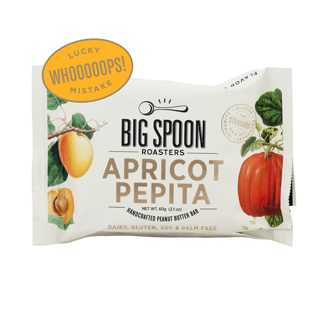 Big Spoon Roasters Apricot Pepita Bar with "Whoops! Lucky Mistake" sticker.