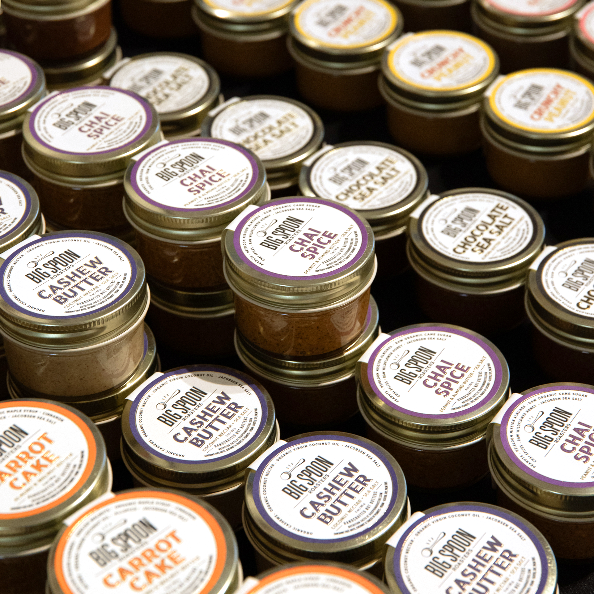 Assorted variety of mini 3 oz jars of nut butters