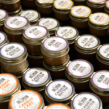 Assorted variety of mini 3 oz jars of nut butters