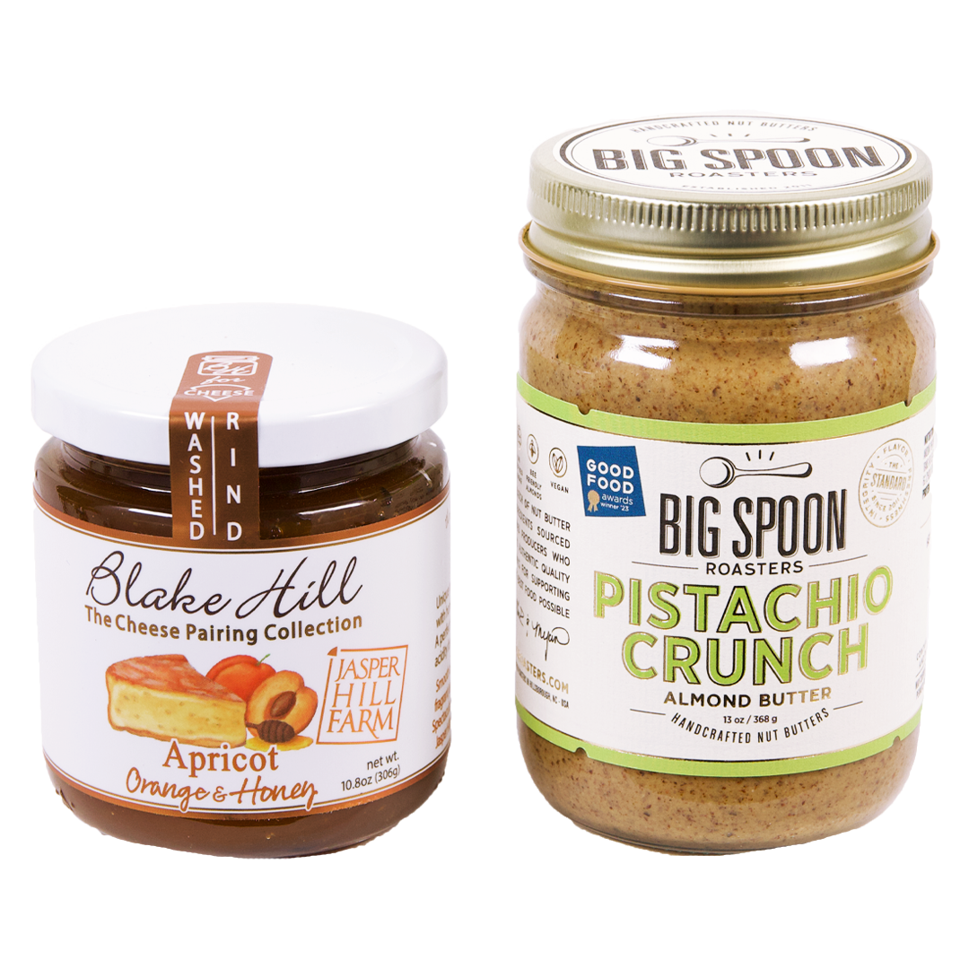 jar of Apricot jam next to a 13oz jar of Pistachio Crunch Almond Butter