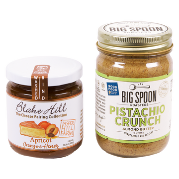 jar of Apricot jam next to a 13oz jar of Pistachio Crunch Almond Butter