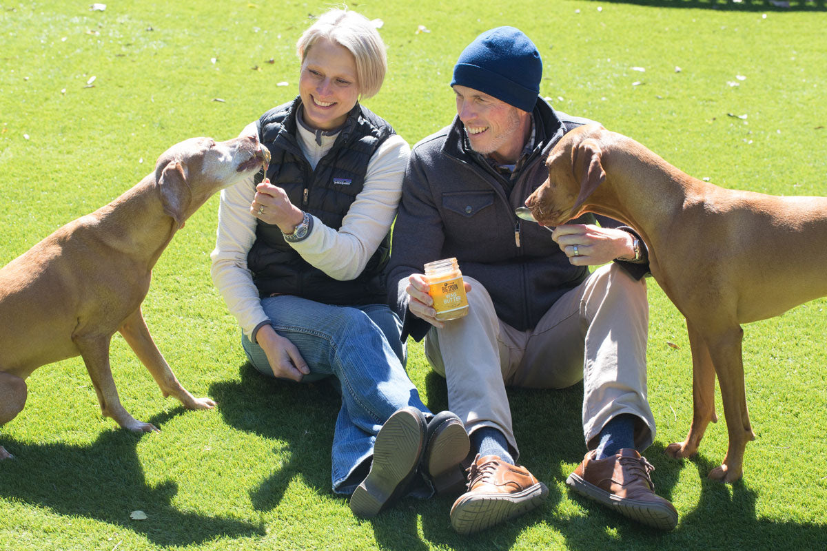 Mark and Megan Overbay feeding Wag Butter to their Vizslas, Rioja and Grüner