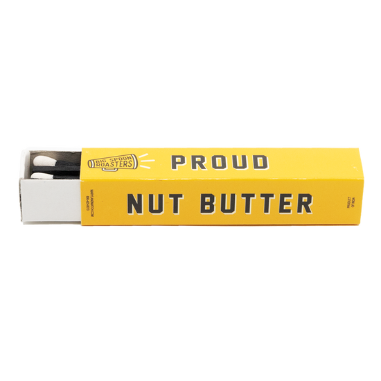 Big Spoon Roasters yellow matchbox reading "PROUD NUT BUTTER ACTIVIST"