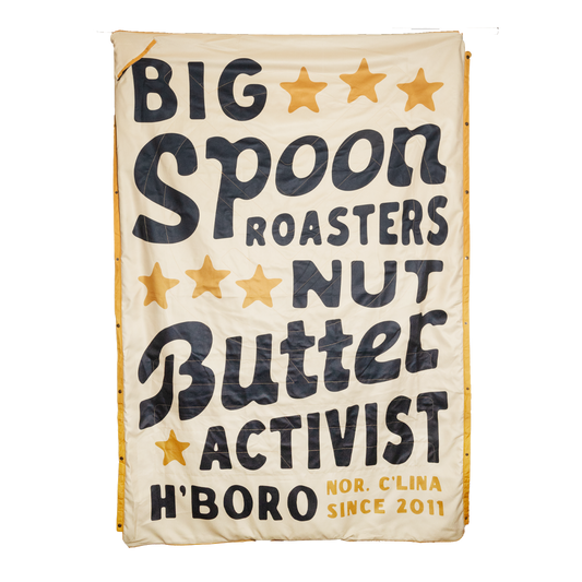Big Spoon Roasters Beach Blanket that states Big Spoon Roasters Nut Butter Activist H'Boro N'Clina Since 2011