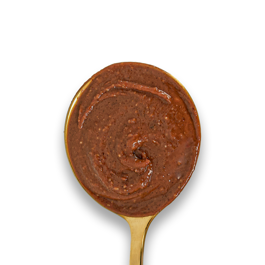  Dark Chocolate Hazelnut & Almond Butter swirled on a golden spoon. 