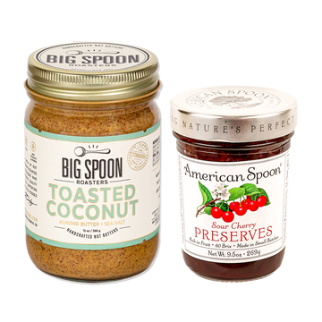 One jar of peanut butter from Big Spoon Roasters and one jar of sour cherry preserves from American Spoon on white background