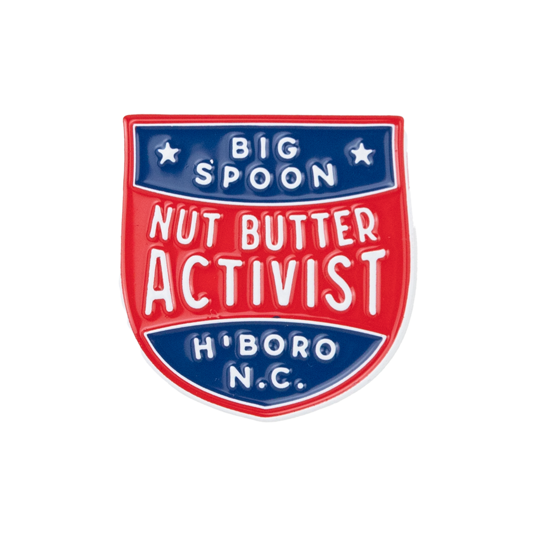 pin reading "BIG SPOON NUT BUTTER ACTIVIST H'BORO NC"