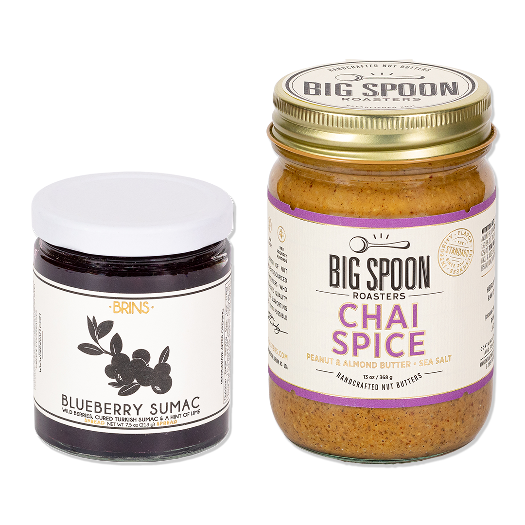 7.5 oz glass jar of Brins Blueberry Sumac Jam and 13 oz glass jar of Big Spoon Roasters Chai Spice