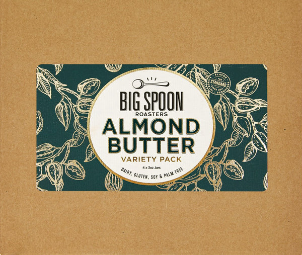 Cardboard box cover with Almond Butter Variety Pack Label on top, made with dark green and gold foil almond art