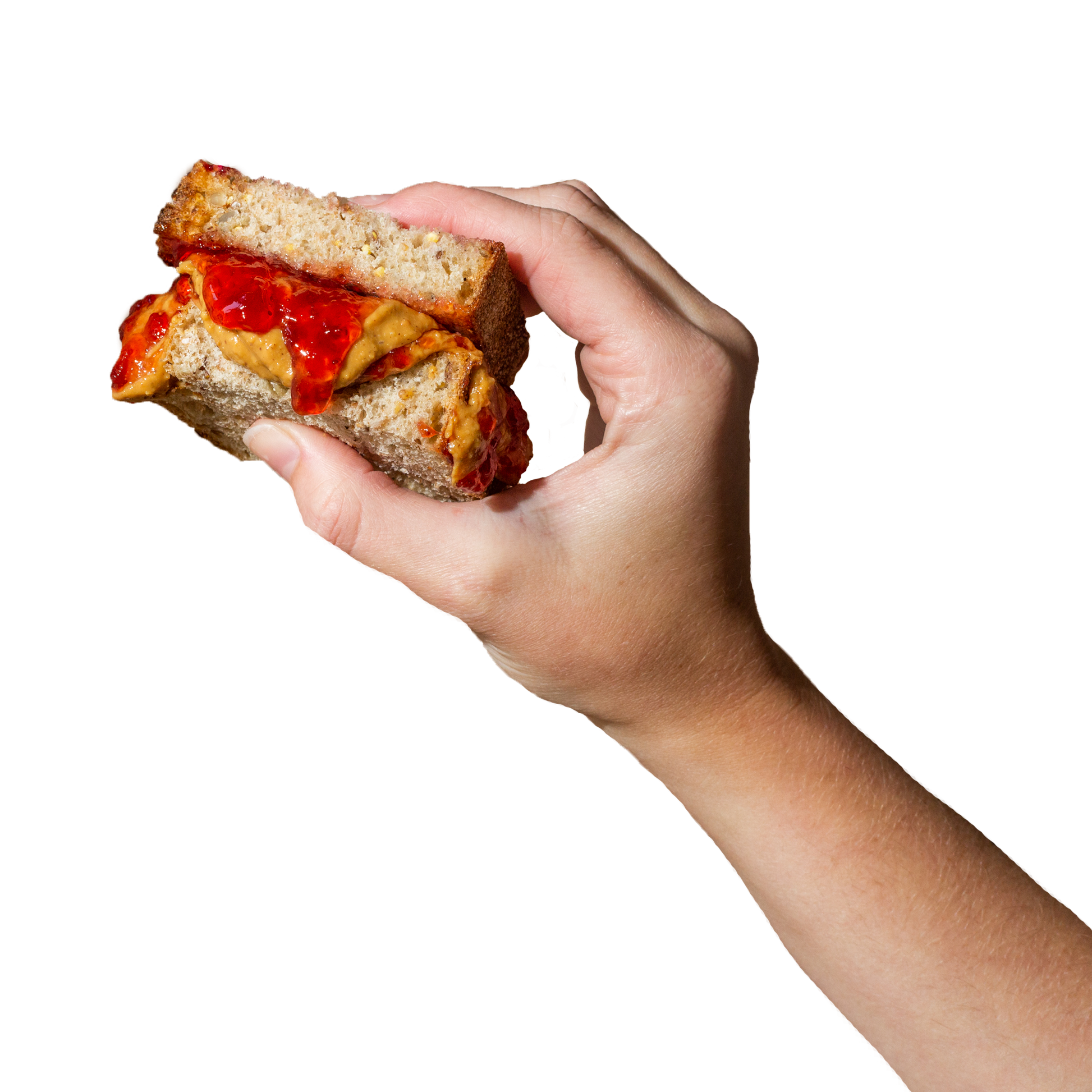 hand holding PB&J sandwich